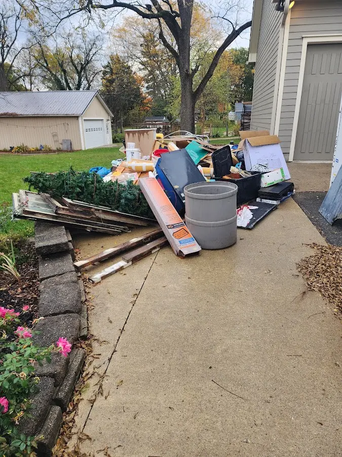 Dumpster being loaded with debris for 3 Yard Dumpster Rental in Clewiston